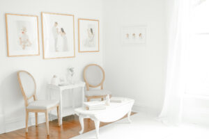 Kristie Lloyd's newborn photography studio Nashville with all white walls and luxury artwork