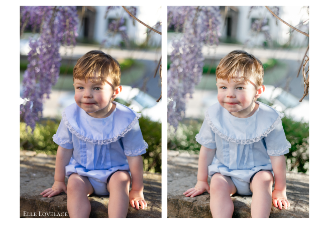 Little boy in a blue heirloom outfit sits in front of purple wisteria.
