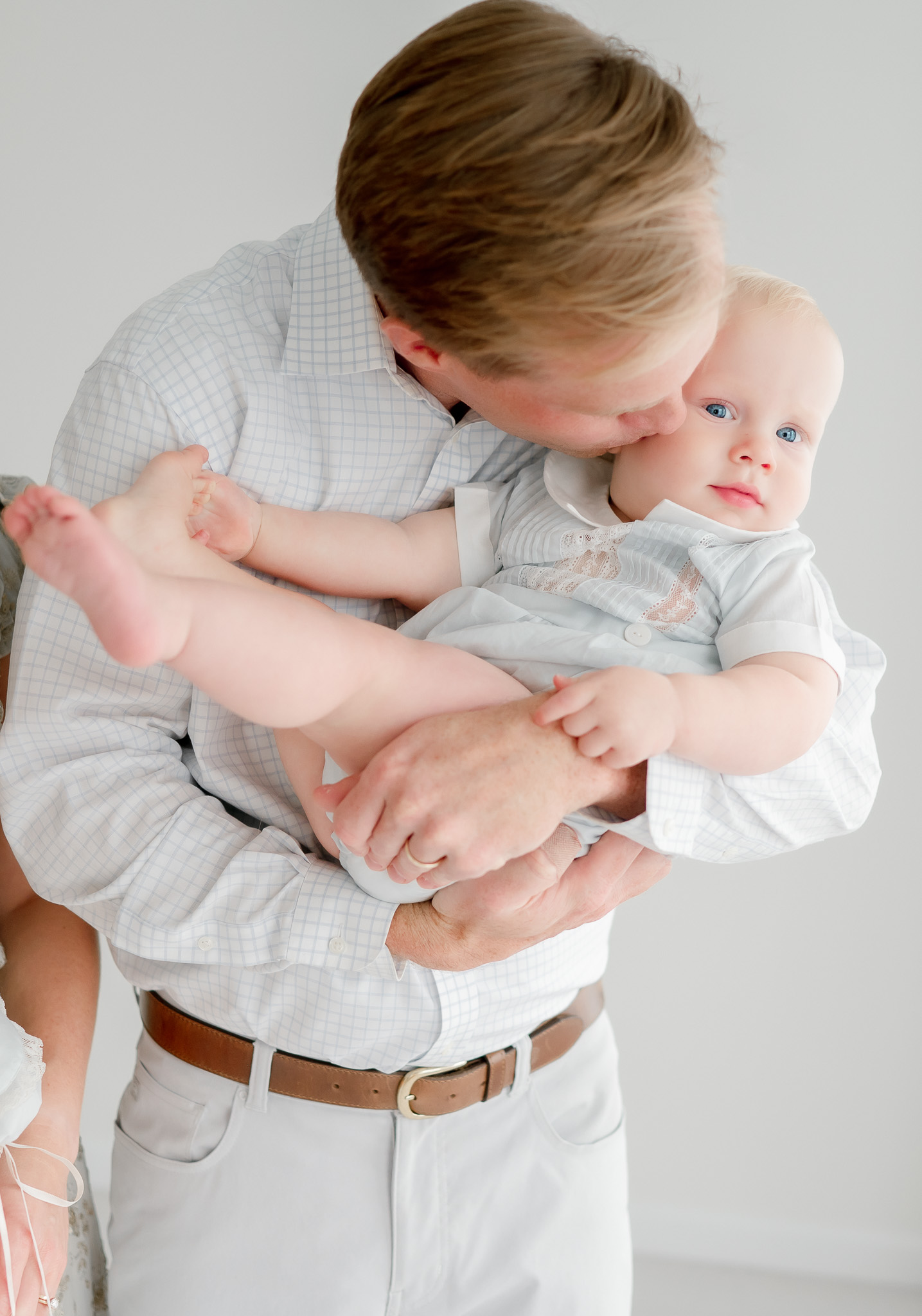 A father kisses his baby son